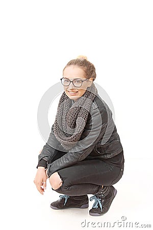 A girl in a demi-season clothes In a snood on a white background. Stock Photo