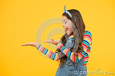 Girl demonstrate product. Promoting product for kids. Launching product. Advertisement concept. Product presentation Stock Photo