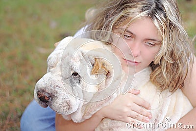 Girl depressed white dog Stock Photo