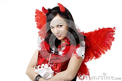 Girl in a devil costume with a gift Stock Photo