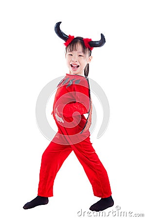 Girl in devil halloween costume standing over white Stock Photo