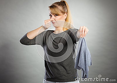 Girl with disgusting rag in hand. Stock Photo