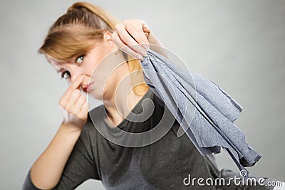 Girl with disgusting rag in hand. Stock Photo