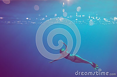 Girl dive underwater Stock Photo