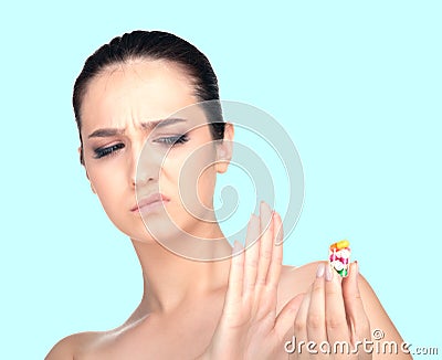 The girl does not want to take pills . Stock Photo