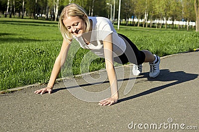 Girl does warm up on the street Stock Photo