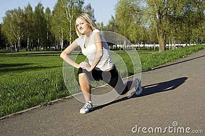 Girl does workout in nature Stock Photo