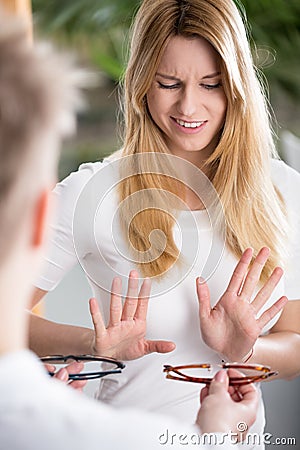 Girl doesn't want to wear eyeglasses Stock Photo