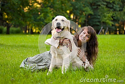 Girl with a dog on the grass Stock Photo