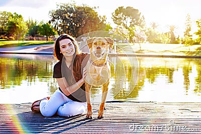 Girl and Dog at Park Sunflare Stock Photo