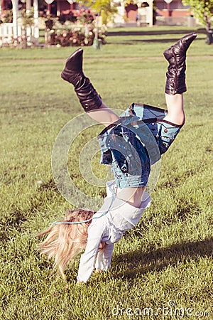 Girl doing hand stand Stock Photo