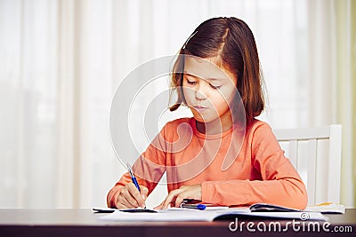 Girl is doing homework Stock Photo