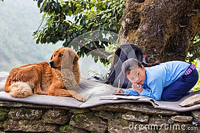 Girl doing homework outdoor Editorial Stock Photo