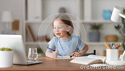 Girl doing homework or online education Stock Photo