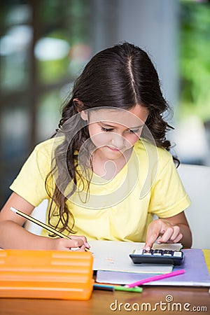 Girl doing math homework Stock Photo