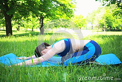 Girl doing yoga on fresh air Stock Photo