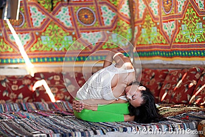 Girl doing yoga indoors Stock Photo