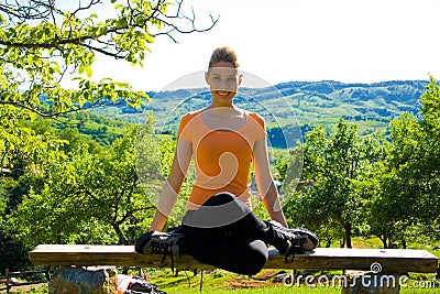 Girl doing yoga outdoors Stock Photo