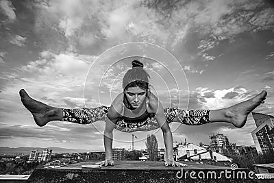 Girl doing yoga outdoors. Stock Photo