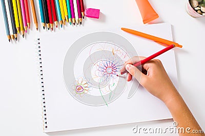 Girl drawing a colorful flower first person Stock Photo