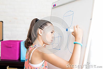 Girl Drawing Geometric Shapes On Flip Chart Stock Photo