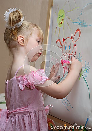 Girl draws a cow Stock Photo