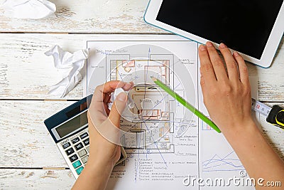 Girl draws a plan of Feng Shui for the home Stock Photo