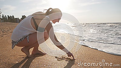 Guys are filming some girls on the beach