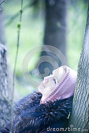 Girl dreaming in the forest Stock Photo