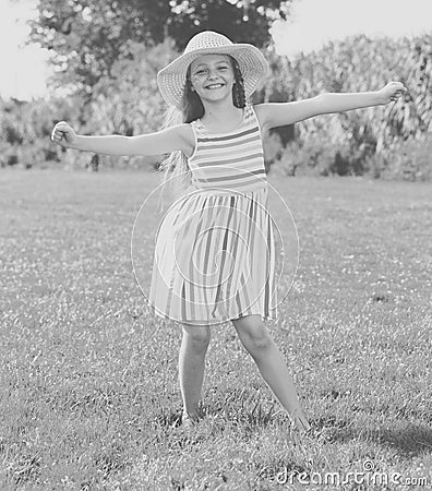 Girl in dress standing outdoors Stock Photo