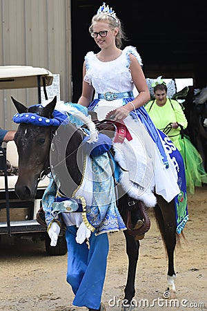 Girl Dressed as Princess Riding a Horse Editorial Stock Photo