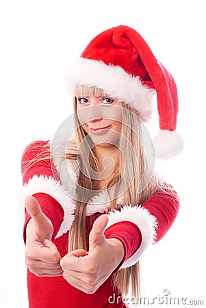 Girl dressed as Santa with her thumbs up Stock Photo