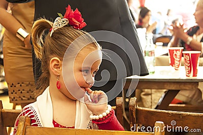 Girl dressed in red traditional costume Editorial Stock Photo