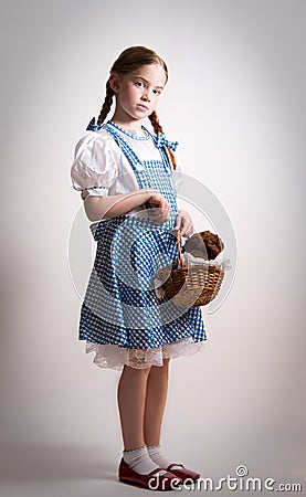 Girl dressed up as Dorothy from Oz Stock Photo