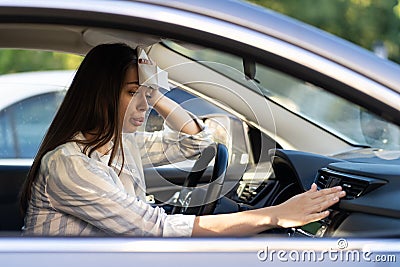 Girl driver has problem with non-working conditioner hand checking flow cold air suffering from heat Stock Photo