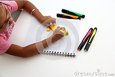 Girl with dysgraphia, writing ability disorder, with intellectual and neurological deficiency, learning and language disorder Stock Photo