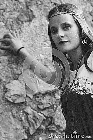 Girl with earring hippie peace symbol, make love not war. photography vintage style. Stock Photo