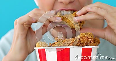 Girl eating chicken wings Stock Photo