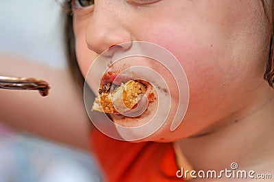 Girl Eating Chocolate Bread Stock Photo