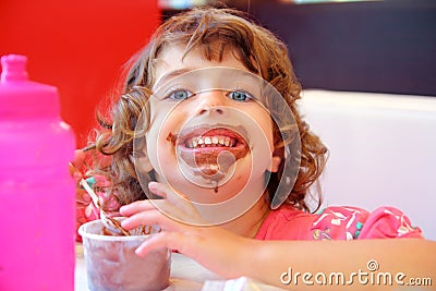 Girl eating chocolate ice cream dirty face Stock Photo