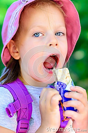 Girl eating chocolate wafers -chocolate bar Stock Photo