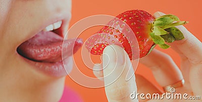 Girl eating fresh strawberries, close-up Stock Photo