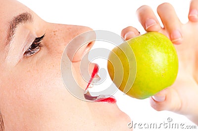 Girl eating green apple close up Stock Photo