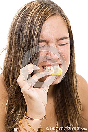 Girl eating lemon Stock Photo