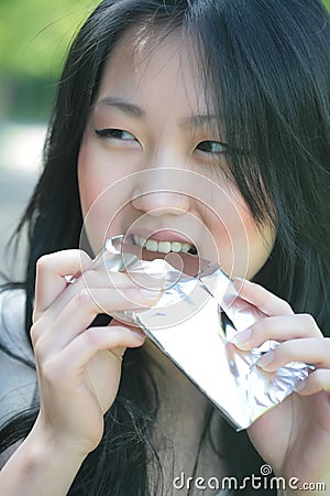 Girl eats chocolate Stock Photo