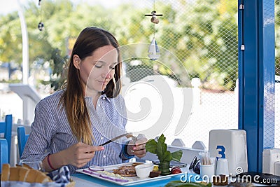 Girl eats in a restaurant Stock Photo