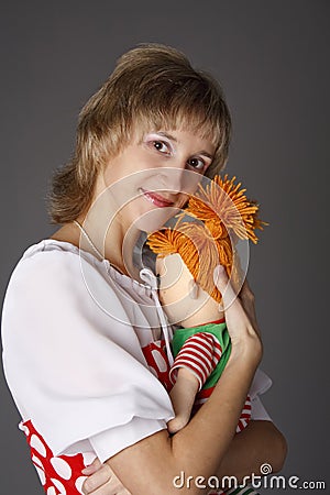 The girl embraces a doll Stock Photo