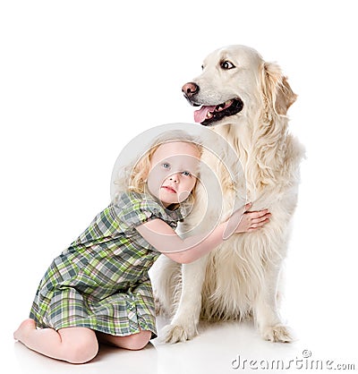 Girl embraces a Golden Retriever. Stock Photo