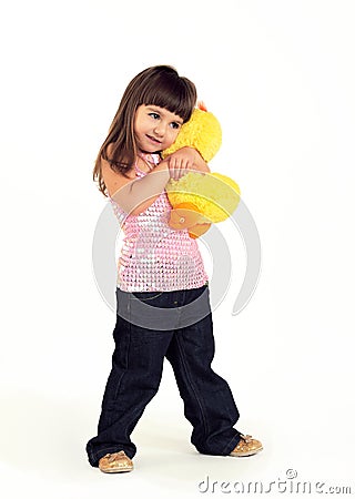 The girl embraces a soft toy Stock Photo