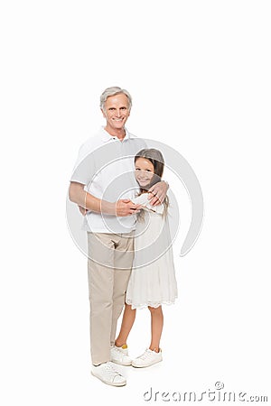 Girl embracing with grandfather Stock Photo